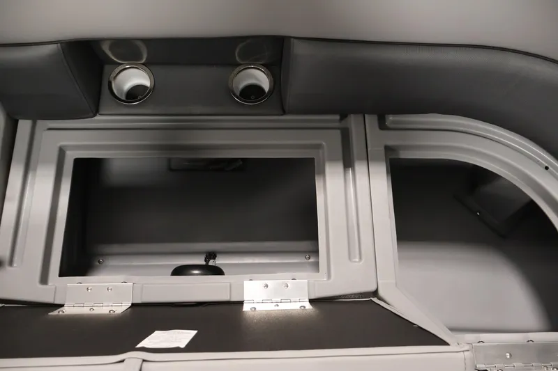 Slide: The Image of Interior storage compartment of 2026 Bentley Pontoons 220 Navigator with cup holders. - 11