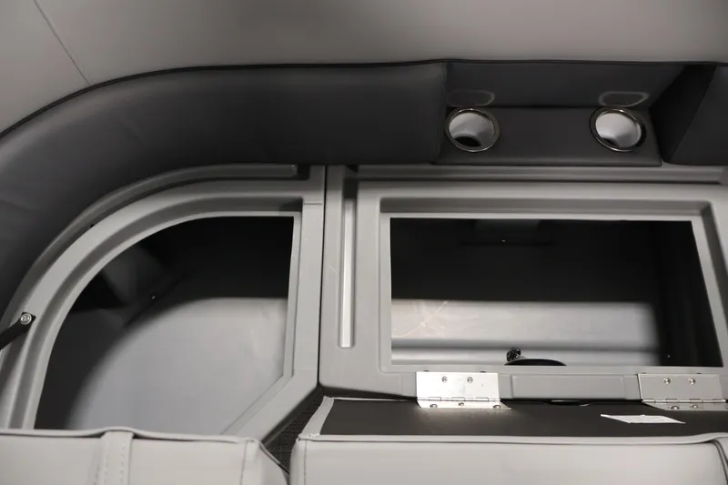 Slide: The Image of Interior storage compartment of 2026 Bentley Pontoons 220 Navigator with cup holders. - 13
