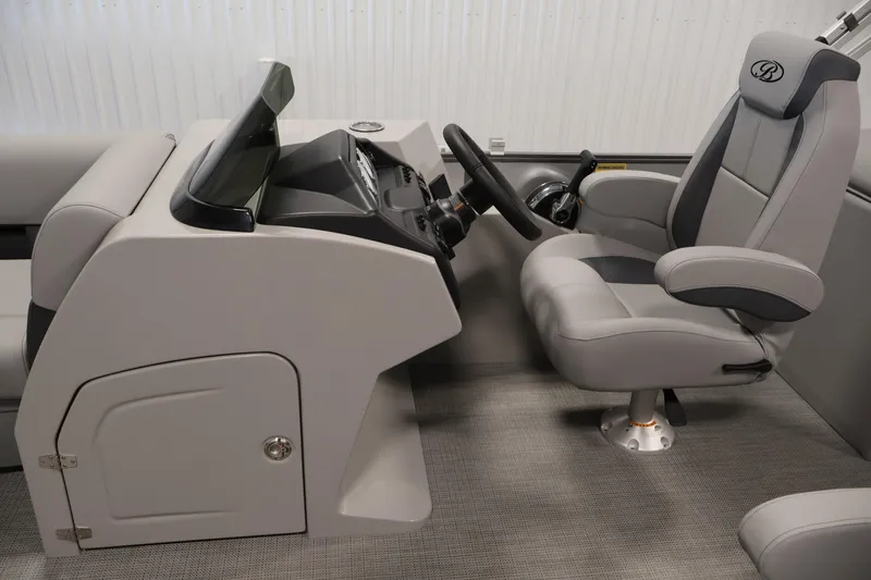 Slide: The Image of 2026 Bentley Pontoons 220 Navigator helm with modern steering and comfortable seating. - 14