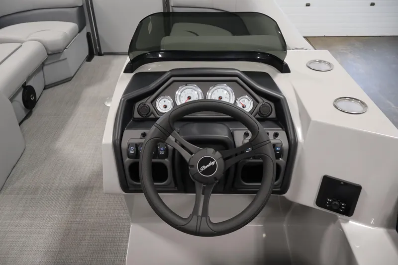Slide: The Image of 2026 Bentley Pontoons 220 Navigator dashboard with steering wheel and gauges. - 15