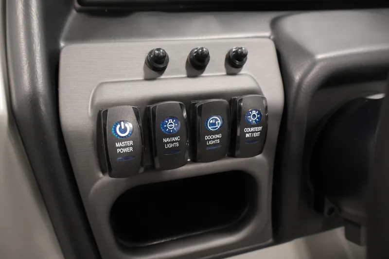 Slide: The Image of Control panel of 2026 Bentley Pontoons 220 Navigator with labeled switches for lights and power. - 18