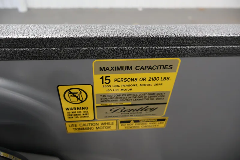 Slide: The Image of Bentley Pontoons 220 Navigator 2026 capacity label, 15 persons or 2180 lbs limit. - 21