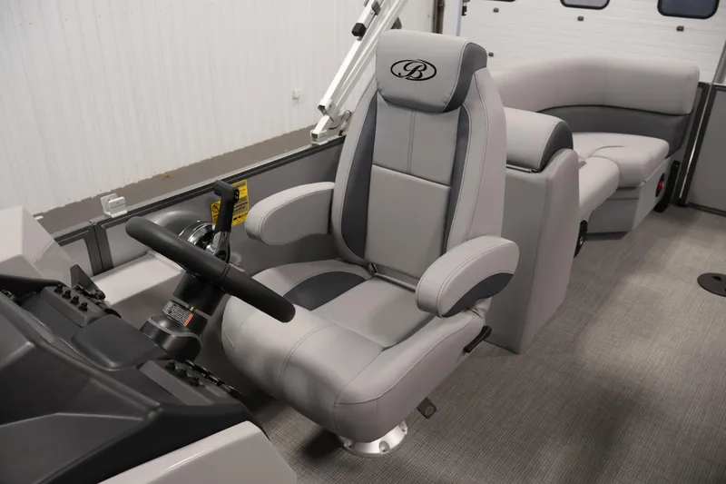 Slide: The Image of 2026 Bentley Pontoons 220 Navigator interior with luxurious seating and modern steering console. - 22