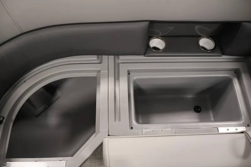 Slide: The Image of Interior of 2026 Bentley Pontoons 220 Navigator, featuring storage compartments and cup holders. - 27