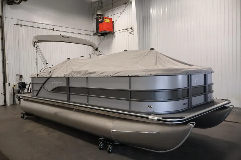 Slide: The Image of 2026 Bentley Pontoons 220 Navigator covered in a storage facility. - 34