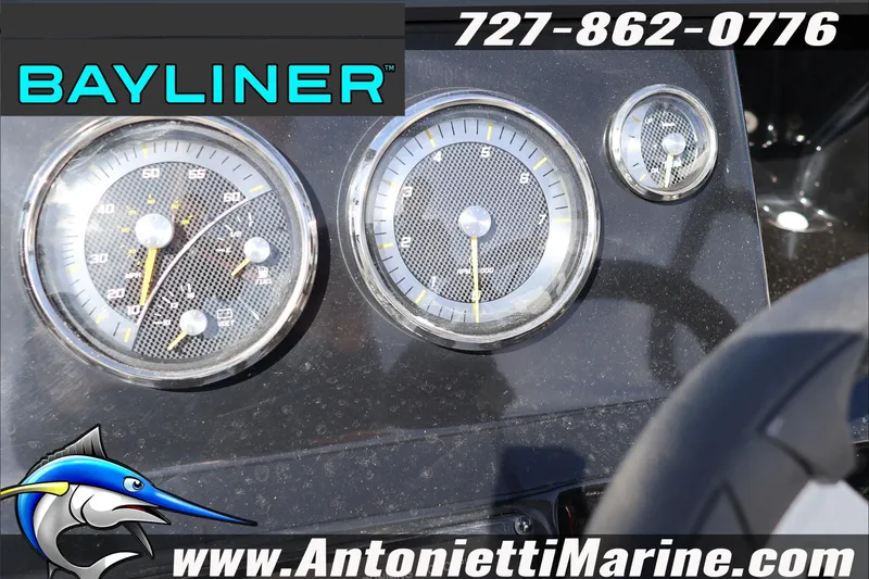 Slide: The Image of Dashboard of 2026 Bayliner V20 boat with gauges and branding. - 12