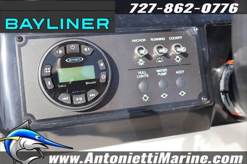 Slide: The Image of Control panel of 2026 Bayliner V20 boat with Jensen audio system and switches. - 13