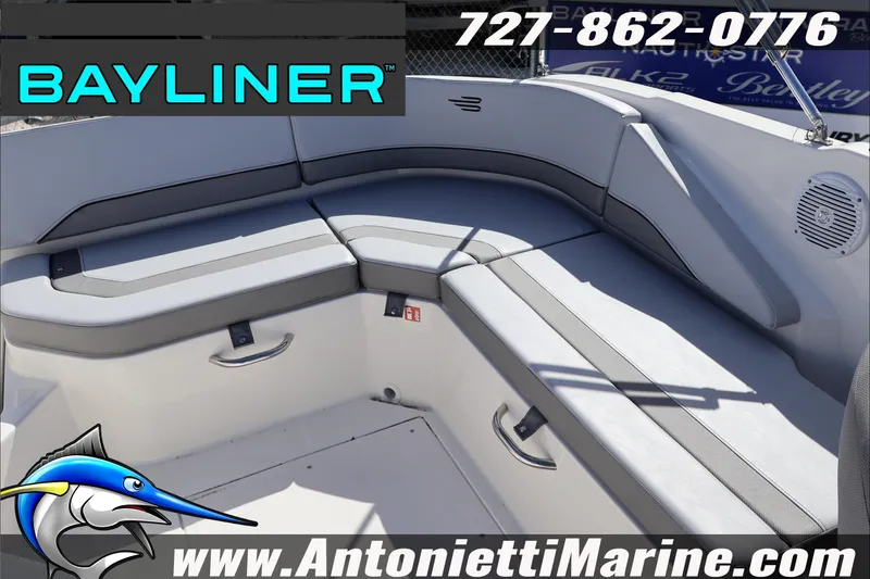 Slide: The Image of 2026 Bayliner V20 boat interior with gray seating, contact info, and Antonietti Marine logo. - 23