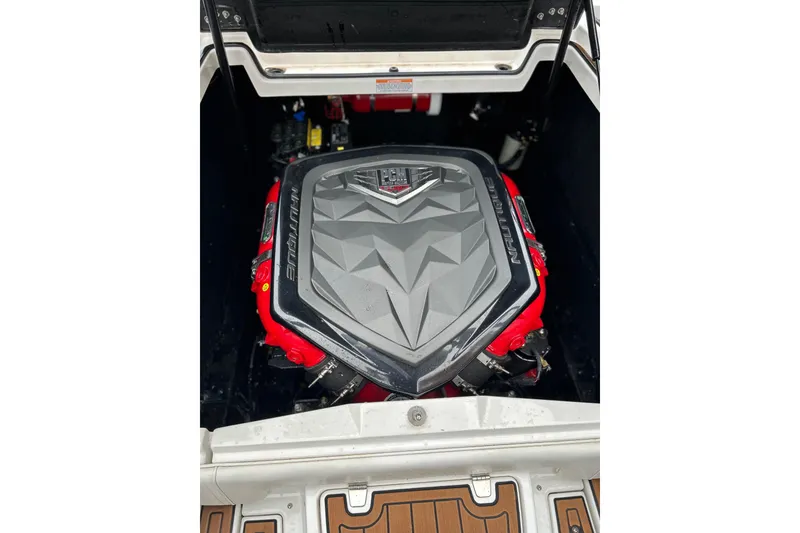 Slide: The Image of 2019 Nautique Super Air Nautique G21 engine compartment with PCM engine cover. - 15