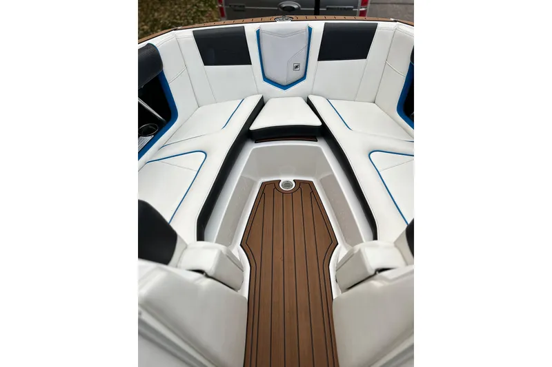 Slide: The Image of 2019 Nautique Super Air Nautique G21 interior with white seating and teak flooring. - 20