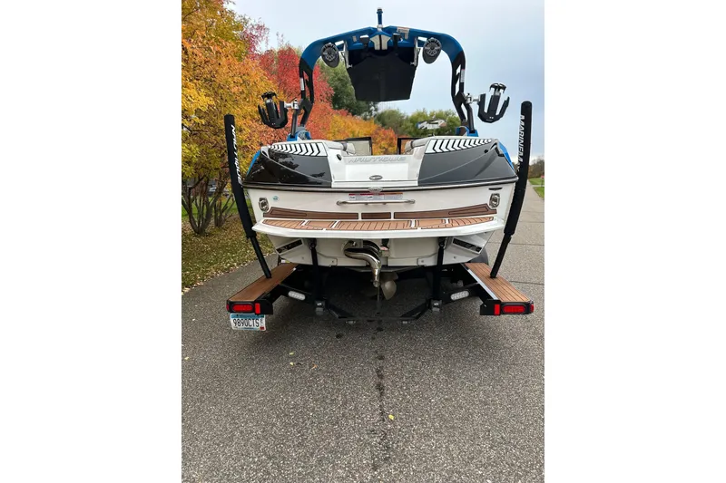 Slide: The Image of 2019 Nautique Super Air Nautique G21 boat on trailer, autumn background. - 6