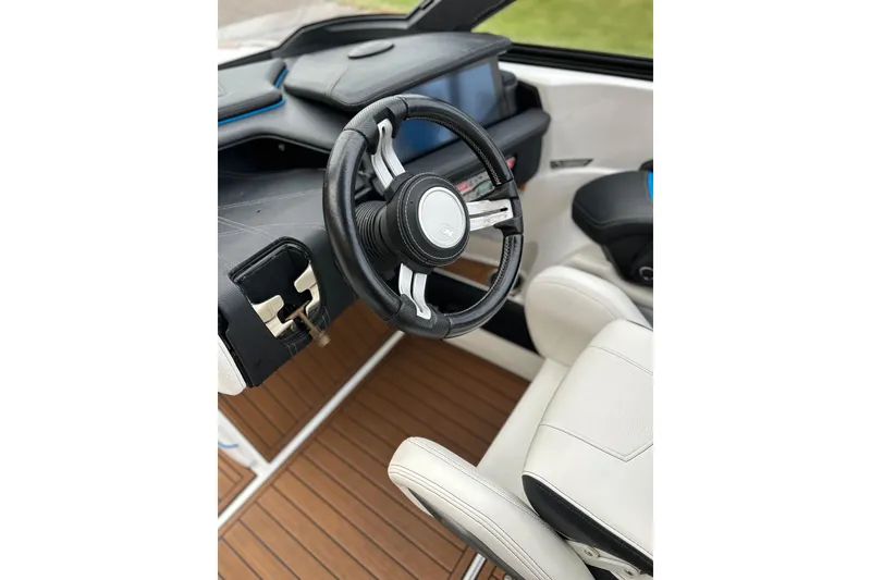 Slide: The Image of 2019 Nautique Super Air Nautique G21 steering wheel and dashboard interior. - 7