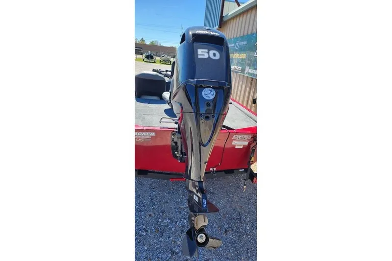 Slide: The Image of Outboard motor on a 2026 Tracker Bass Tracker Classic XL boat, parked outdoors. - 10