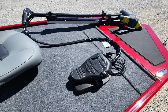 Slide: The Image of 2026 Tracker Bass Tracker Classic XL boat deck with trolling motor and foot pedal. - 13