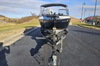 Slide: The Image of 2019 Tracker Pro Guide V-175 WT boat on trailer, parked outdoors. - 10