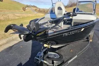 Slide: The Image of 2019 Tracker Pro Guide V-175 WT boat on trailer, parked on a sunny day. - 11