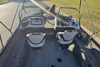 Slide: The Image of 2019 Tracker Pro Guide V-175 WT boat interior with seating and control panel. - 3