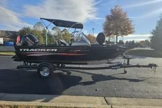 Slide: The Image of 2019 Tracker Pro Guide V-175 WT boat on trailer, parked outdoors. - 4