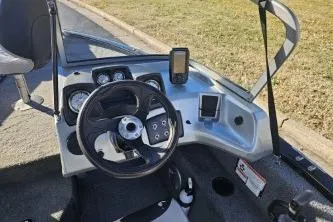 Slide: The Image of 2019 Tracker Pro Guide V-175 WT boat dashboard with steering wheel and navigation equipment. - 5