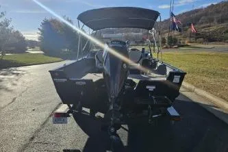 Slide: The Image of 2019 Tracker Pro Guide V-175 WT boat on a trailer, parked outdoors. - 6