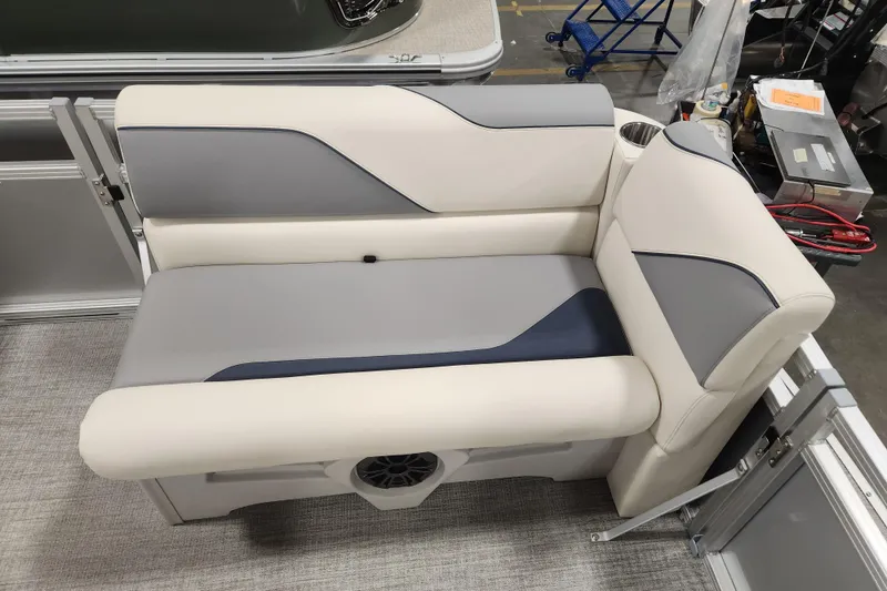 Slide: The Image of 2026 Avalon Venture Cruise Rear Bench with gray and cream upholstery in a boat interior. - 12