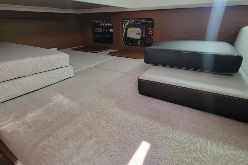 Slide: The Image of Interior cabin of 2023 Jeanneau NC 895 with cushions and control panel. - 26