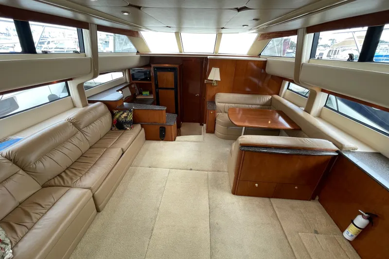 Slide: The Image of Luxurious interior of 2006 Meridian 459 Motoryacht with plush seating and elegant wood finishes. - 17