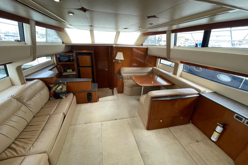 Slide: The Image of Luxurious interior of 2006 Meridian 459 Motoryacht with plush seating and elegant wood finishes. - 18