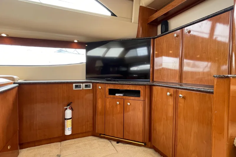Slide: The Image of Luxurious interior of 2006 Meridian 459 Motoryacht with wood cabinetry and flat-screen TV. - 19