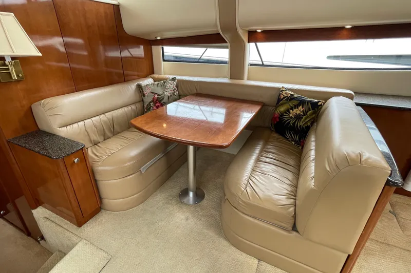 Slide: The Image of Luxurious 2006 Meridian 459 Motoryacht interior with plush seating and elegant wooden table. - 22