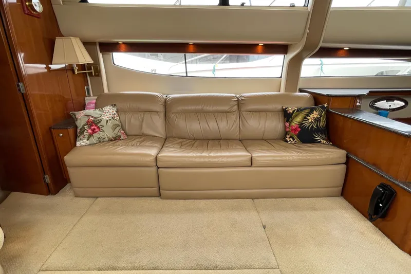 Slide: The Image of Luxurious interior of 2006 Meridian 459 Motoryacht with beige leather sofa and floral cushions. - 23