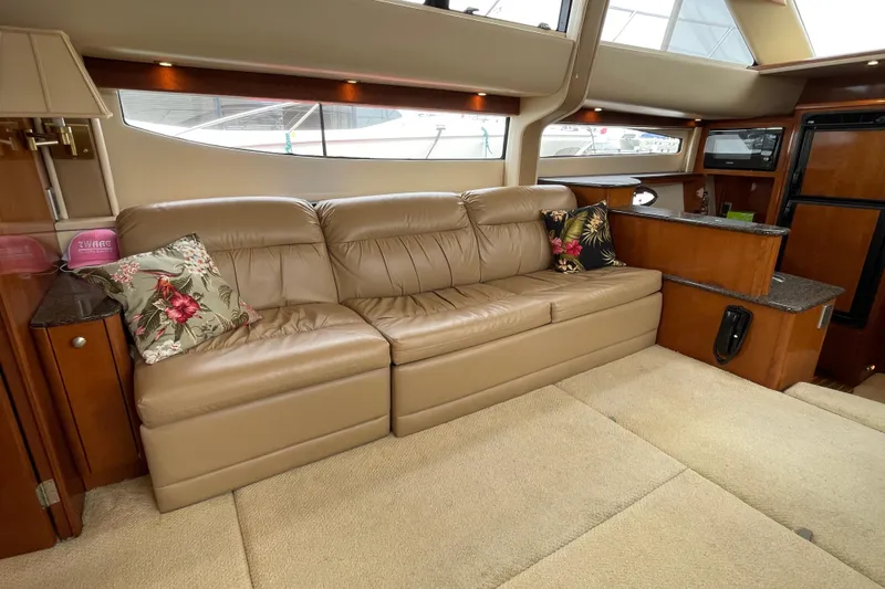 Slide: The Image of Luxurious interior of 2006 Meridian 459 Motoryacht with leather sofa and decorative pillows. - 24