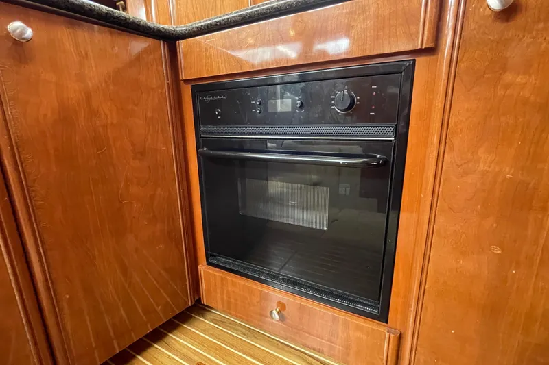 Slide: The Image of Built-in oven in 2006 Meridian 459 Motoryacht's wooden kitchen interior. - 29
