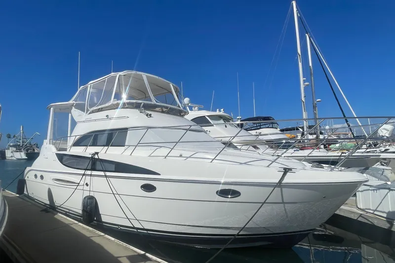 Slide: The Image of 2006 Meridian 459 Motoryacht docked at marina under clear blue sky. - 3