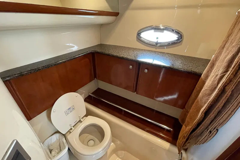 Slide: The Image of Bathroom interior of 2006 Meridian 459 Motoryacht with granite countertop and porthole window. - 42
