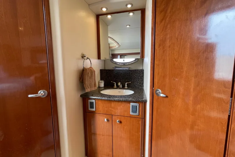 Slide: The Image of Luxurious bathroom in 2006 Meridian 459 Motoryacht with wood cabinetry and granite countertop. - 43