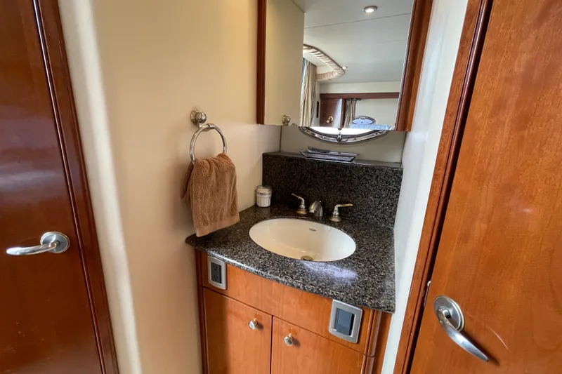 Slide: The Image of Luxurious bathroom in 2006 Meridian 459 Motoryacht with granite countertop and wooden cabinetry. - 44