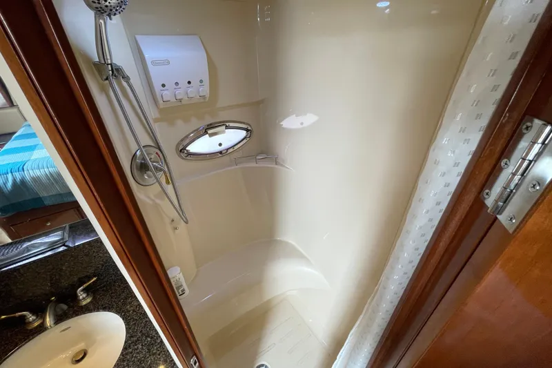 Slide: The Image of Shower area in 2006 Meridian 459 Motoryacht with handheld showerhead and porthole window. - 45