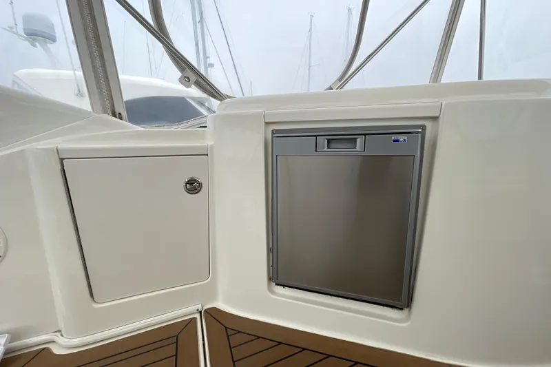 Slide: The Image of 2006 Meridian 459 Motoryacht interior with stainless steel appliance and storage cabinet. - 48