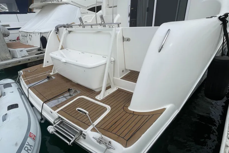 Slide: The Image of 2006 Meridian 459 Motoryacht swim platform with teak decking and storage. - 6