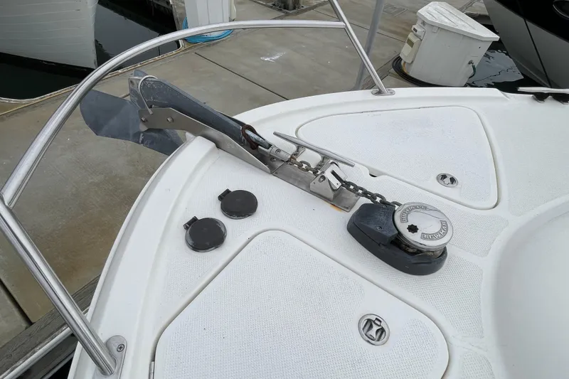 Slide: The Image of 2006 Meridian 459 Motoryacht anchor system on deck at marina. - 61