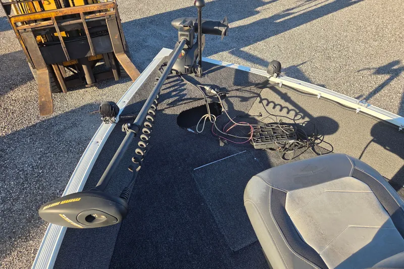 Slide: The Image of 2017 Lowe Fishing Machine 160 Pro boat deck with trolling motor and seat. - 10