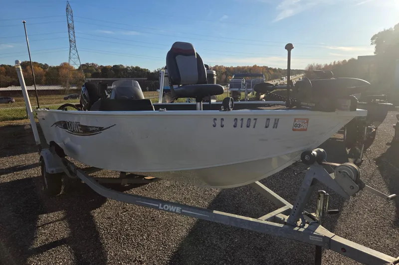 Slide: The Image of 2017 Lowe Fishing Machine 160 Pro on trailer, parked outdoors. - 3