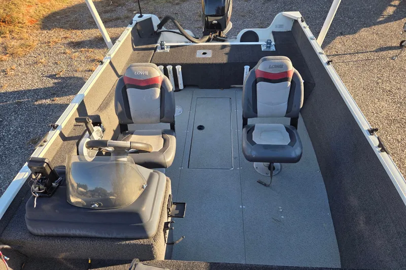 Slide: The Image of 2017 Lowe Fishing Machine 160 Pro interior with two seats and steering console. - 8