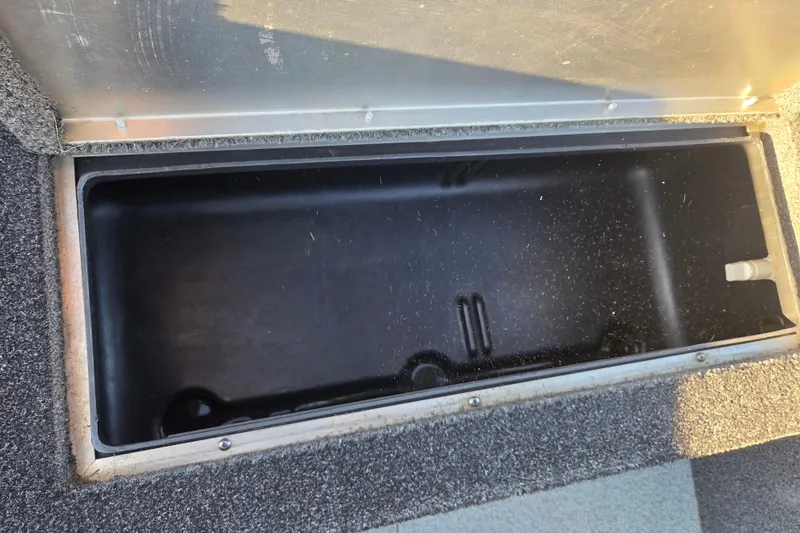 Slide: The Image of Open storage compartment in 2017 Lowe Fishing Machine 160 Pro boat. - 9