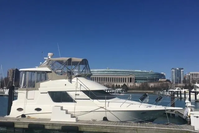 The Image of 1997 Silverton 352 Motor Yacht docked with cityscape and stadium in background. - 0