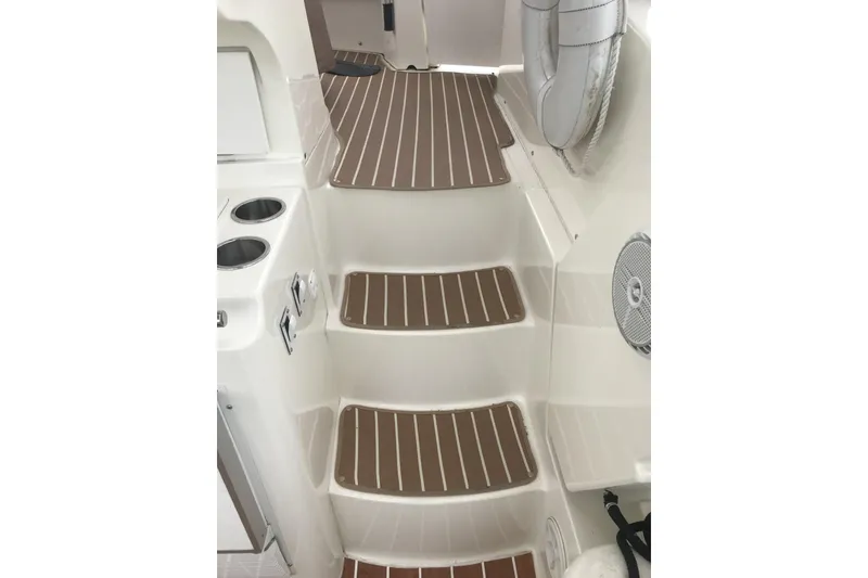Slide: The Image of 1997 Silverton 352 Motor Yacht interior steps with wood-style finish and safety features. - 12