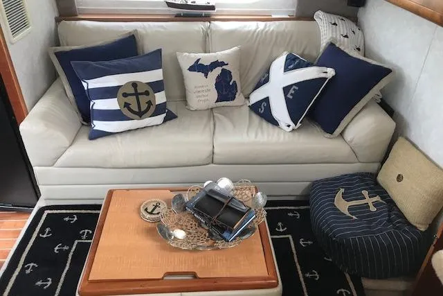 Slide: The Image of Nautical-themed interior of 1997 Silverton 352 Motor Yacht with anchor pillows and decor. - 18