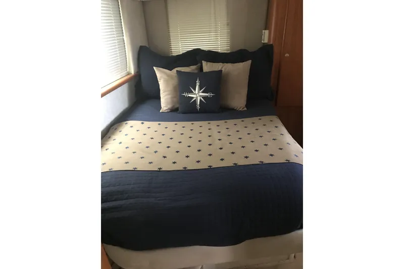 Slide: The Image of Cozy bedroom in 1997 Silverton 352 Motor Yacht with nautical-themed bedding. - 22