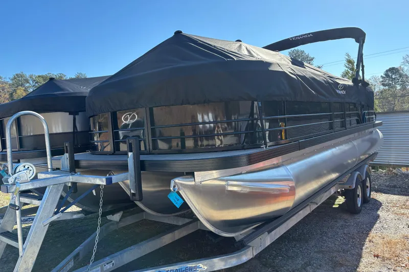 Slide: The Image of 2026 Veranda VISTA VIEW 22RC pontoon boat on trailer, covered and parked outdoors. - 10